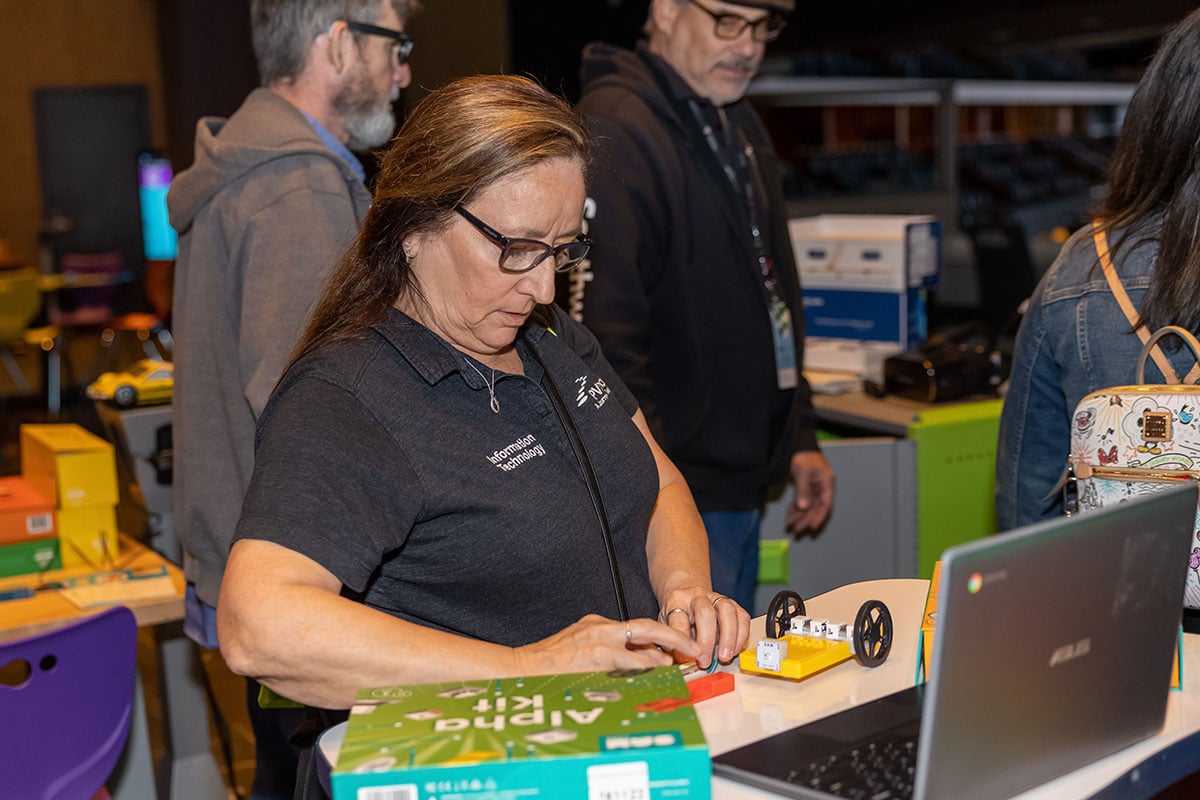 Bluum 2023 Tech Tour Customer building STEM robots