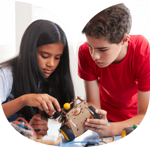 Boy and girl playing with a stem toy.