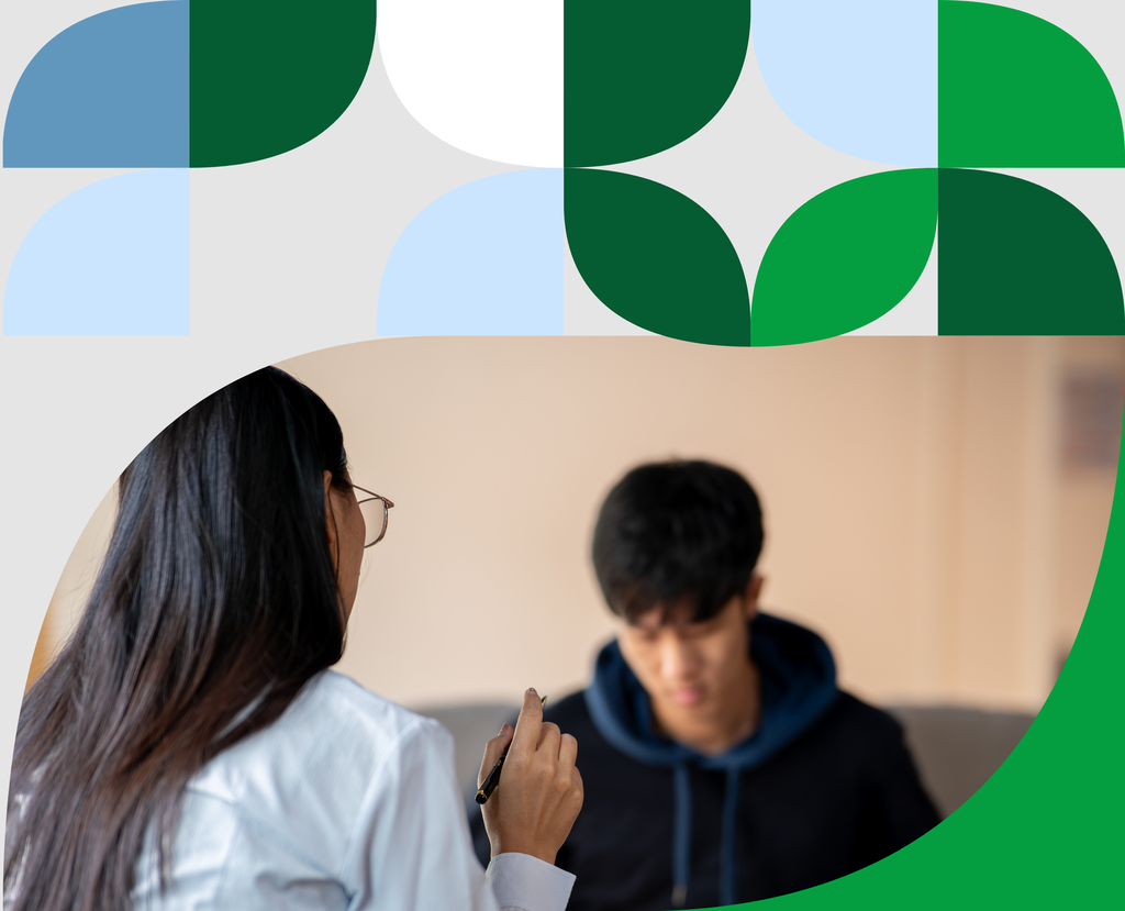 Psychologist speaking with a patient during a session, illustrating how school counseling programs support student well-being