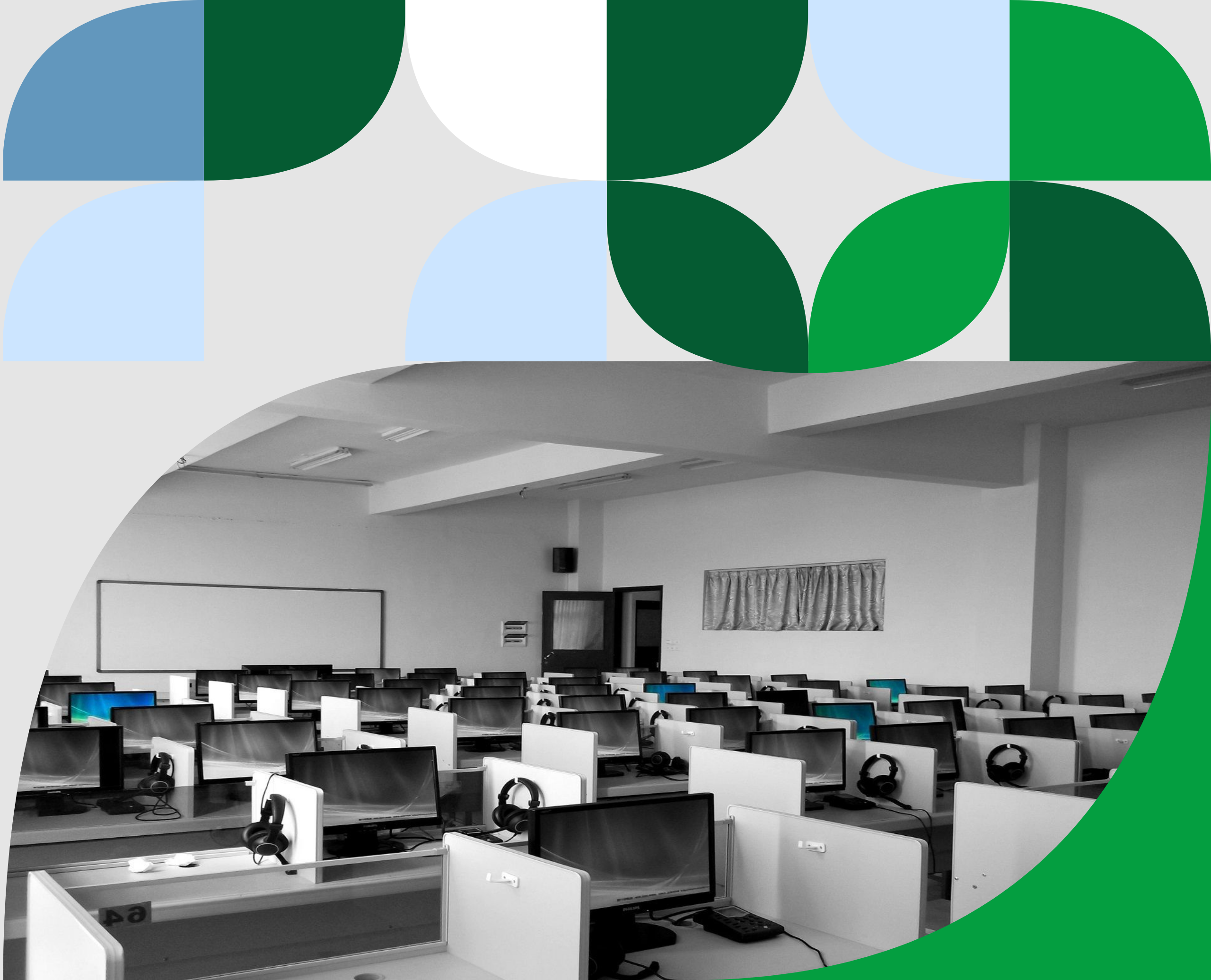 School computer lab equipped with desktop computers, headsets, and individual workstations for student learning