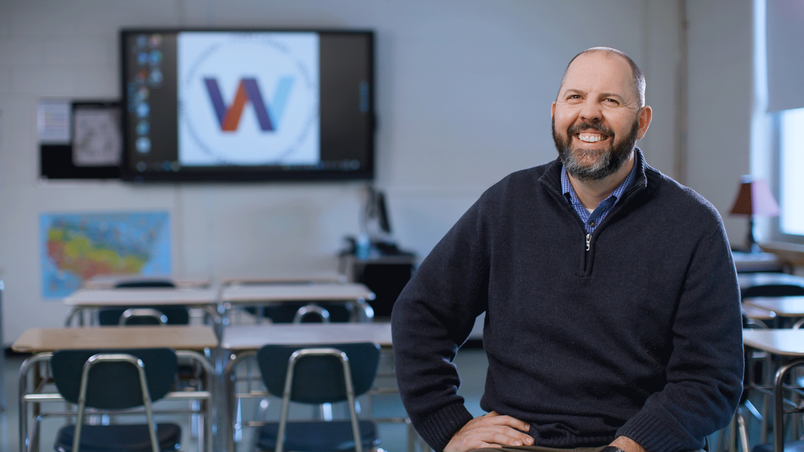 Art Schouten sitting in a classroom.