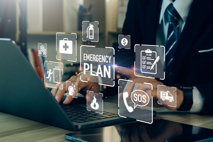 person typing on laptop with emergency bubbles