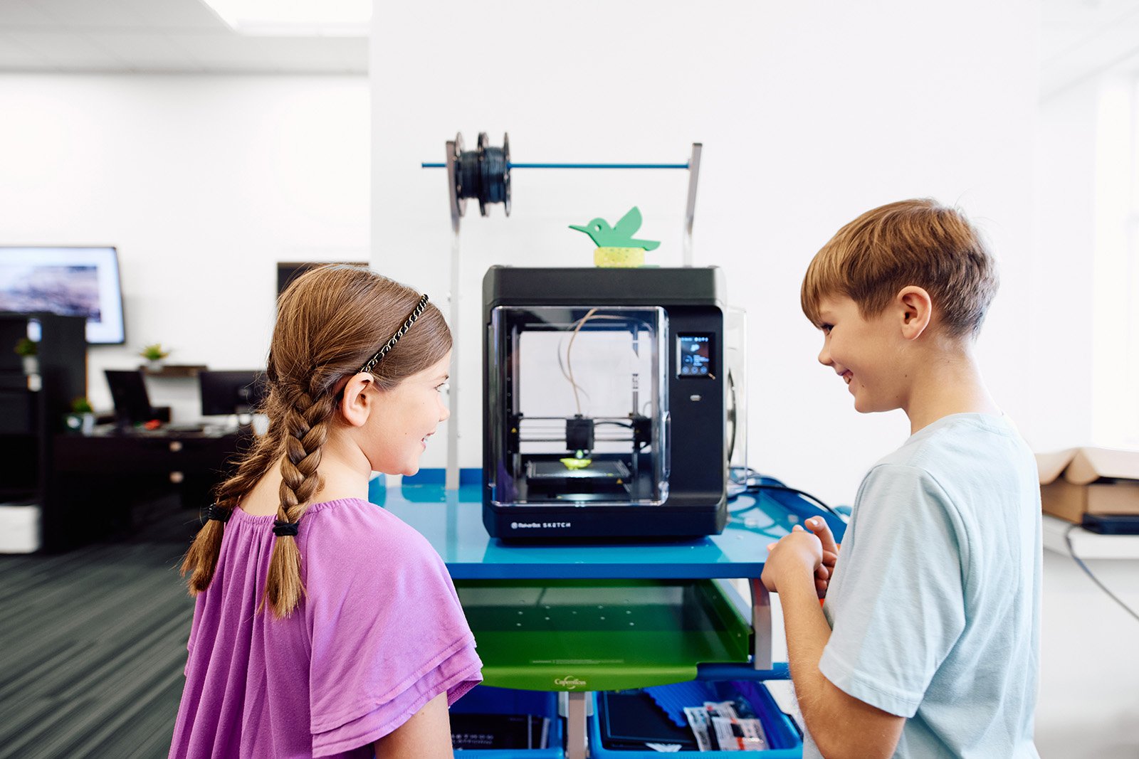 kids playing with 3d printer