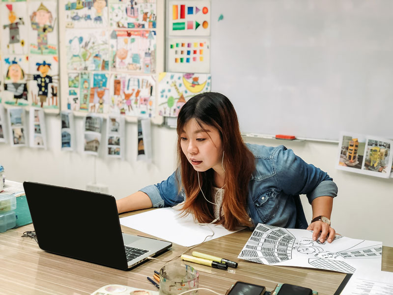 teacher at her desk on her laptop