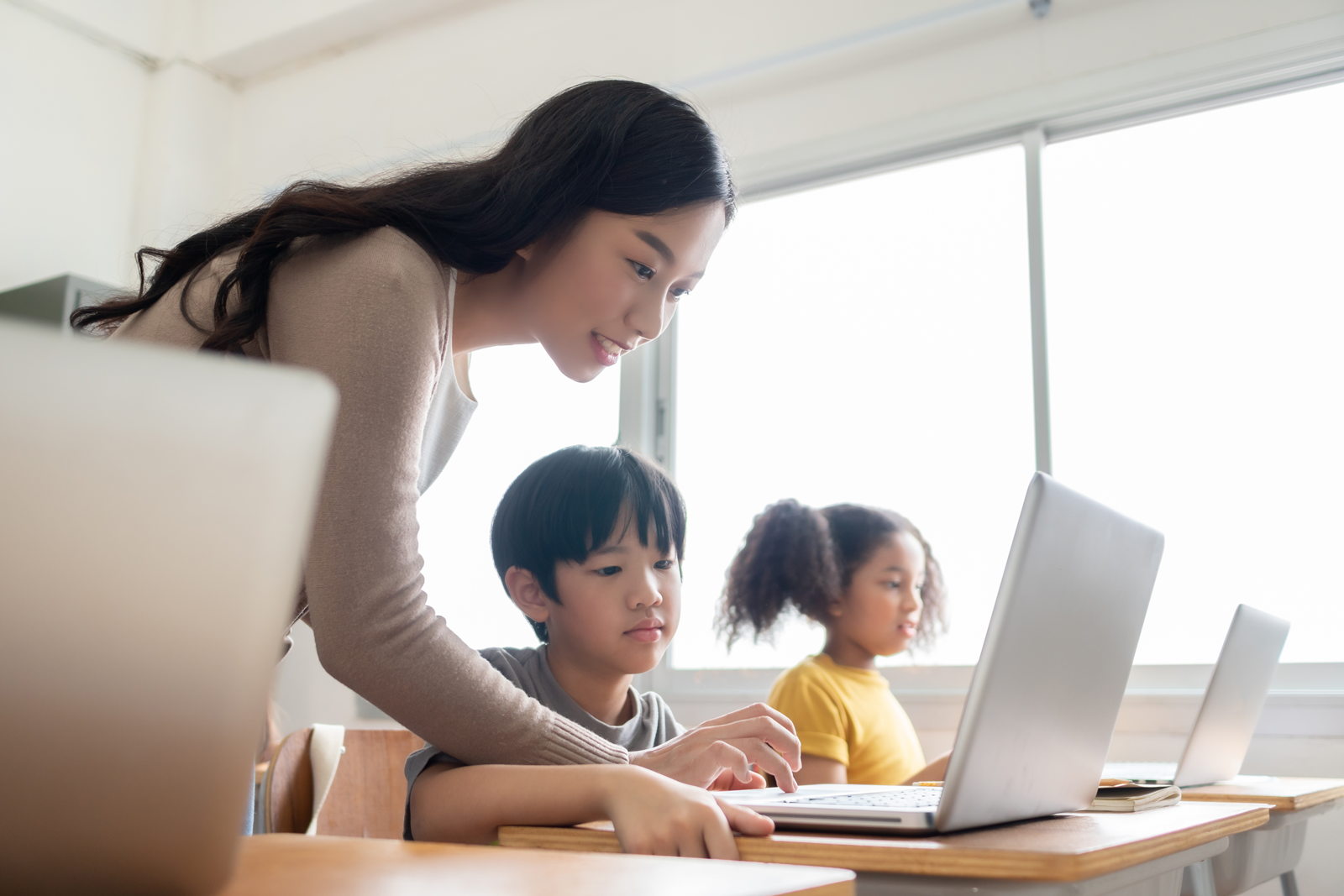 Teacher and student on a laptop