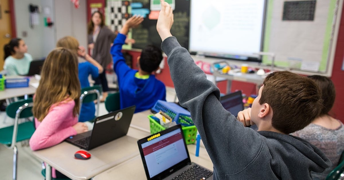 student raising his hand